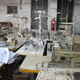 Unused equipment in a garment factory in Dhaka, December 2014. Indirect suppliers are vital to Bangladesh’s ability to respond to fluctuating demand. When orders are down, factories like this one may close a few production lines or shut down altogether. When orders go back up, the lines reopen. This allows large, direct exporters with much higher operating costs to flexibly expand capacity through subcontracts without making expensive capital investments.